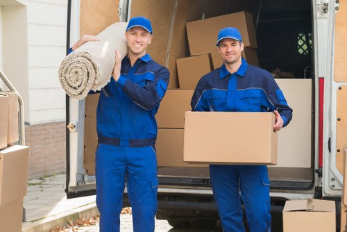 Man and van loading furniture in a Stepney residential street