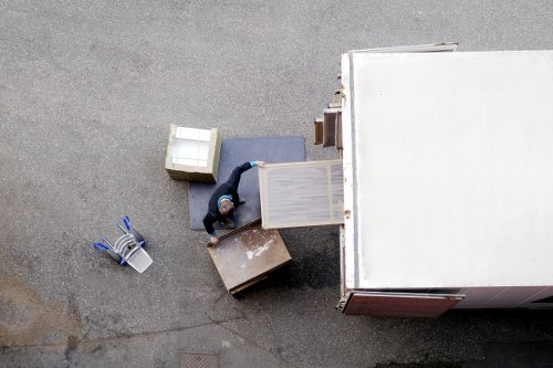 Packed household boxes and furniture ready for home removals in Stepney