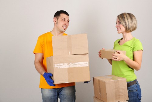 An organised office move process with labelled boxes and workstation setup