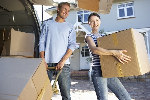 Packed boxes and furniture prepared for a local move in Stepney